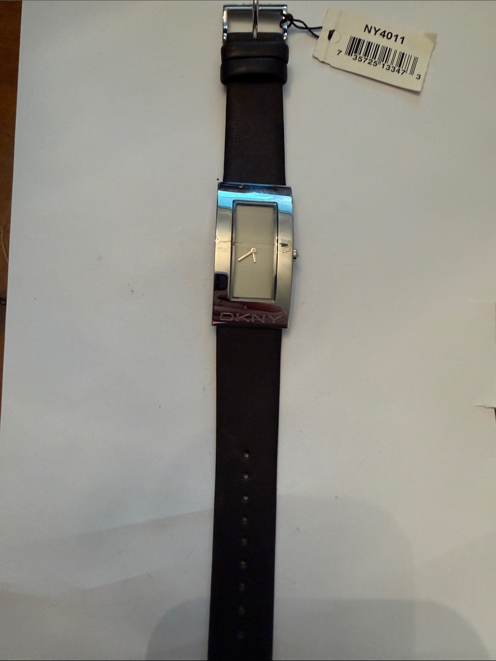 DKNY Silver Rectangular Case Watch with Black Leather Strap